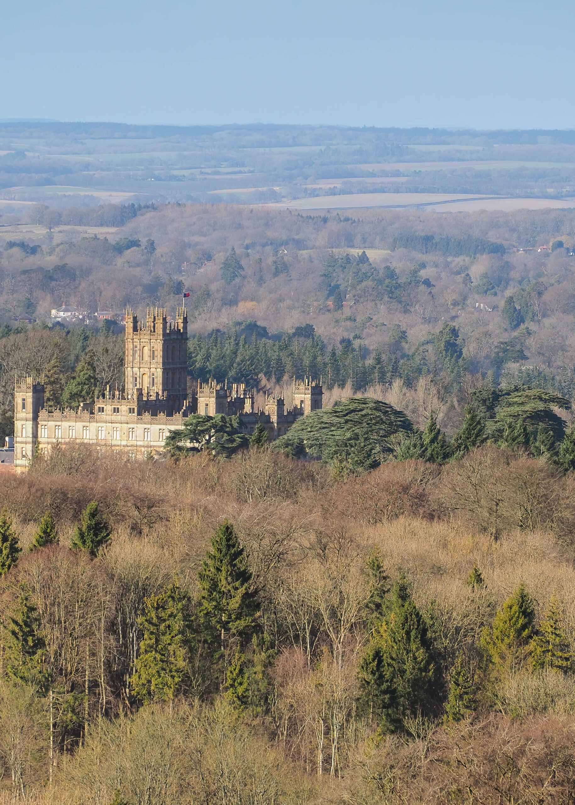 Highclere Castle, location used for the period drama television series Downton Abbey, below Beacon Hill, near Newbury