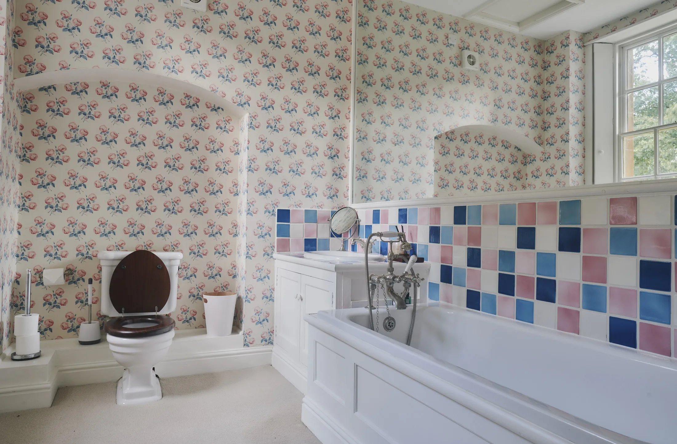 Classic tiled bathroom with period fixtures and natural light at Havenwood exclusive short stay rental in The Cotswolds.