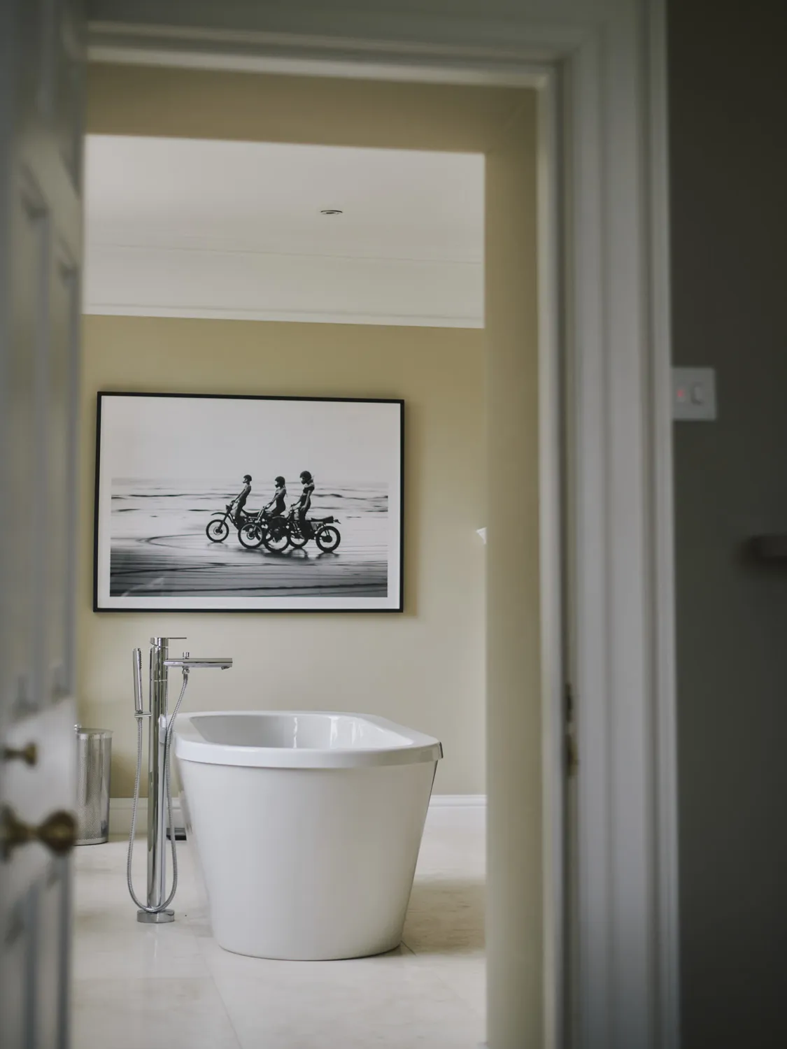 Contemporary bathroom with freestanding tub and oversized photography at Havenwood, a Domus Stay luxury short term escape.