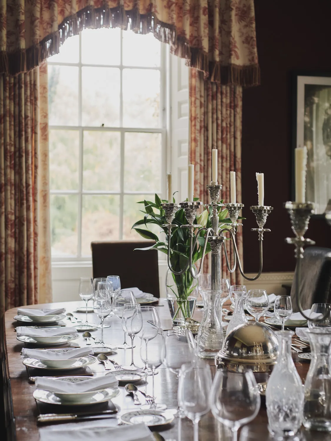 Formal dining room with polished table set for elegant entertaining at Havenwood, an exclusive short stay property in The Cotswolds.